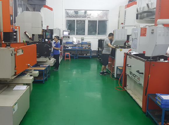 20152015 two workers focus on their jobs in prototyping and low volume production factory